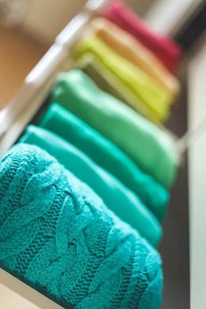 A rack of clothing in a well-organized closet, showcasing various prints and patterns, including stripes, checks, florals, and animal prints, all thoughtfully curated to facilitate easy print mixing for creating diverse outfits.