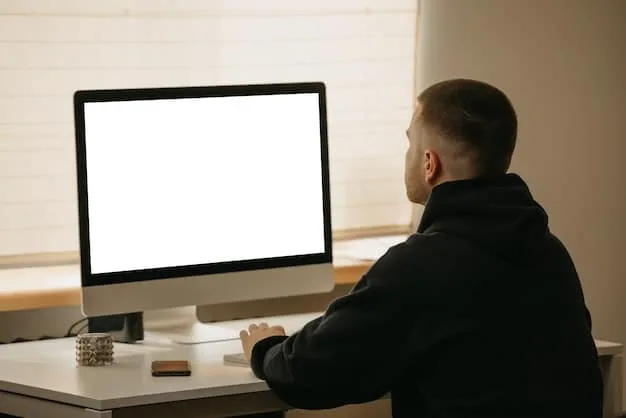 A person sitting at a desk, with a computer screen in the foreground. The screen shows the SHEIN website with a product page displayed. The person has a credit card in hand, ready to make a purchase, while next to the computer is a notepad with