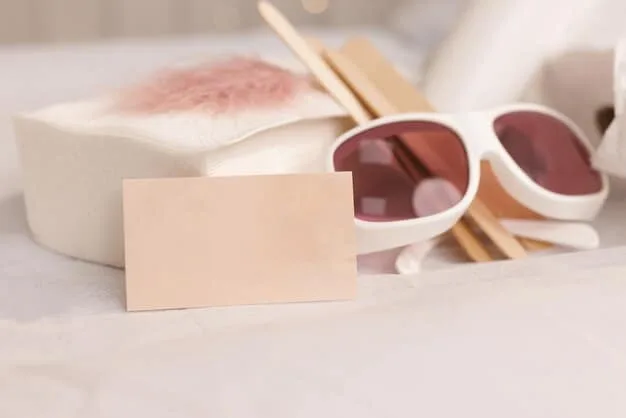 A close-up shot of a SHEIN gift card with a blurred background of various fashionable clothing items and accessories. The gift card is in focus, and the lighting highlights the SHEIN logo.