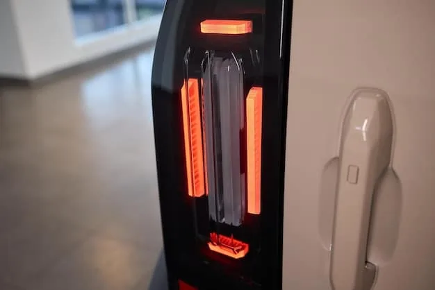 A close-up of an electric vehicle's underside, clearly showing the receiving coil for wireless charging. The image should highlight the technology's integration into the vehicle's design and demonstrate its seamless nature.