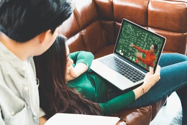 A software developer is seen working on a laptop, with AR development tools displayed on the screen, highlighting the process of creating educational augmented reality applications.