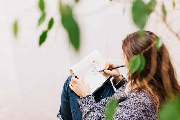 A close-up shot of a person sketching landscaping ideas on a notepad while sitting at an outdoor table in a backyard. The notepad shows a rough sketch of a garden layout with different plant types and features.