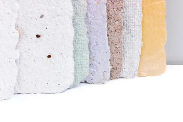 A close-up shot showing different types of insulation materials side-by-side, including fiberglass batting, spray foam, and cellulose. Labels identify each material and highlight their unique textures and compositions.