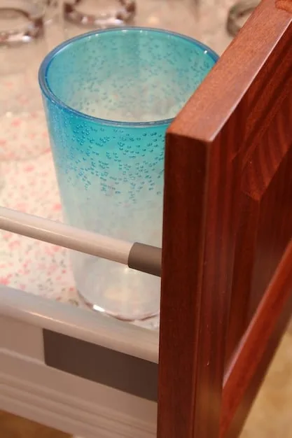 A close-up of corner cushions attached to the sharp edges of a coffee table to prevent injuries to children. The corner cushions are clear and discreetly placed.