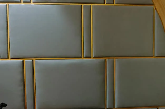 Close-up of soundproofing panels installed on a home office wall, highlighting the material and texture that help absorb sound.